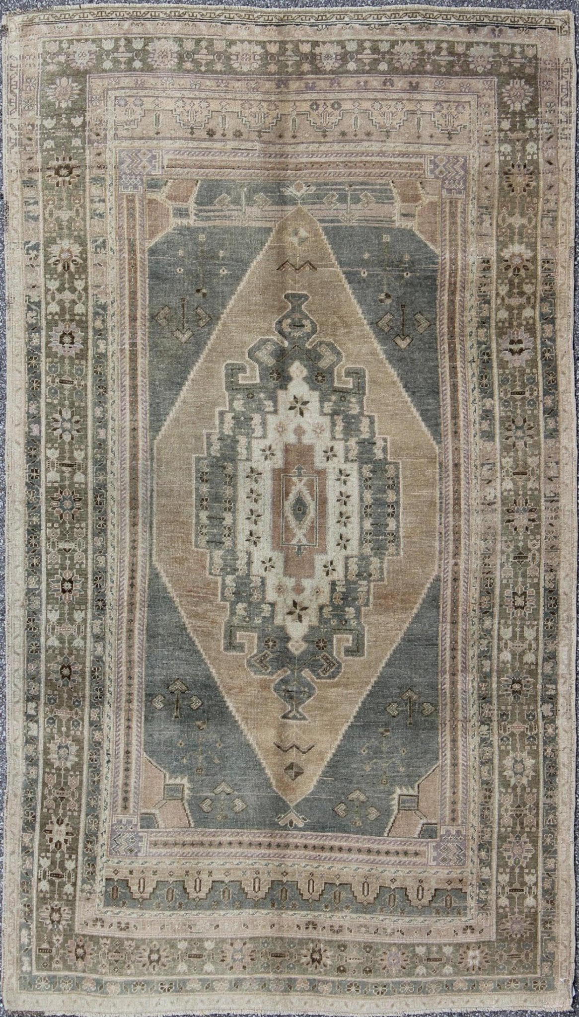 Vintage Oushak in Gray Green, Beige, Camel Background and Light Green Border . Vintage Oushak in Gray Green, Beige, Camel Background and Light Green Border. Rug / TU - UGU - 136007 This unique Turkish Oushak has a Gray green background along ... - Keivan Woven ArtsTU - UGU - 136007 - 4664Rug