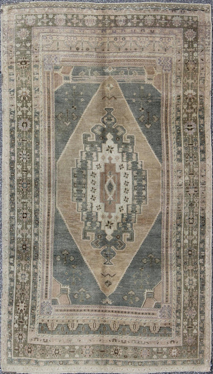 Vintage Oushak in Gray Green, Beige, Camel Background and Light Green Border . Vintage Oushak in Gray Green, Beige, Camel Background and Light Green Border. Rug / TU - UGU - 136007 This unique Turkish Oushak has a Gray green background along ... - Keivan Woven ArtsTU - UGU - 136007 - 4664Rug