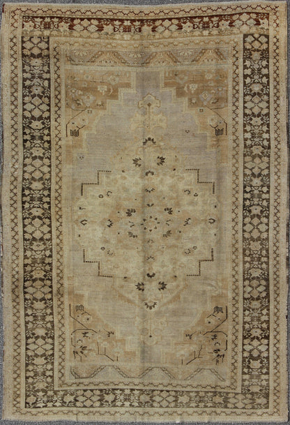 Vintage Turkish Floral Medallion Oushak Area Rug in Tan, Brown and Beige Measures: 7'11 x 11'5 This Vintage Turkish Oushak, from 1940s Turkey, featuring a chocolate brown border with connecting flower and vines. The sandy field combines ... - Keivan Woven ArtsTU - UGU - 14 - 3100Rug