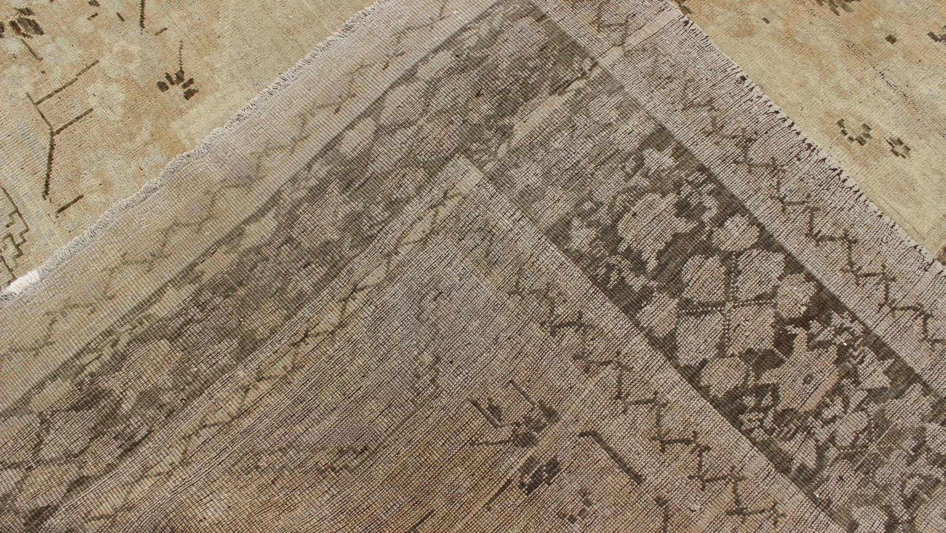 Vintage Turkish Floral Medallion Oushak Area Rug in Tan, Brown and Beige Measures: 7'11 x 11'5 This Vintage Turkish Oushak, from 1940s Turkey, featuring a chocolate brown border with connecting flower and vines. The sandy field combines ... - Keivan Woven ArtsTU - UGU - 14 - 3100Rug