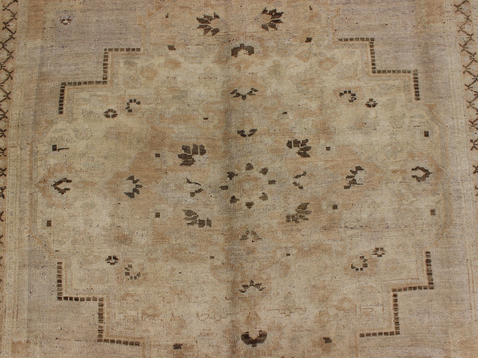 Vintage Turkish Floral Medallion Oushak Area Rug in Tan, Brown and Beige Measures: 7'11 x 11'5 This Vintage Turkish Oushak, from 1940s Turkey, featuring a chocolate brown border with connecting flower and vines. The sandy field combines ... - Keivan Woven ArtsTU - UGU - 14 - 3100Rug