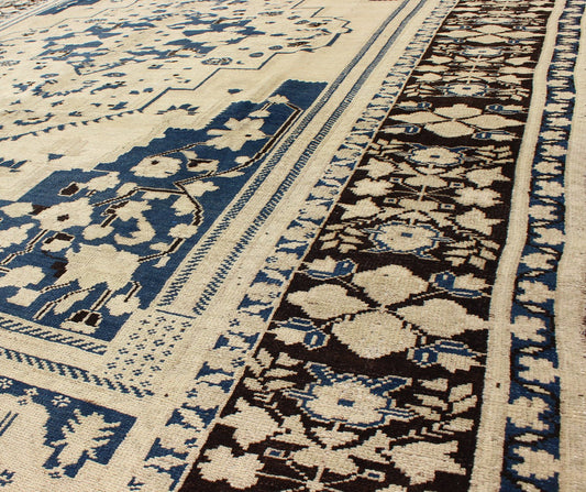 Vintage Turkish Floral Medallion Oushak Rug in Royal Blue and Beige Tones; Measures 7'11 x 10'11 This vintage Oushak features classic Oushak medallion designs, with more contemporary colors. The antique - white field displays a large centra... - Keivan Woven ArtsTU - UGU - 25 - 3132Rug