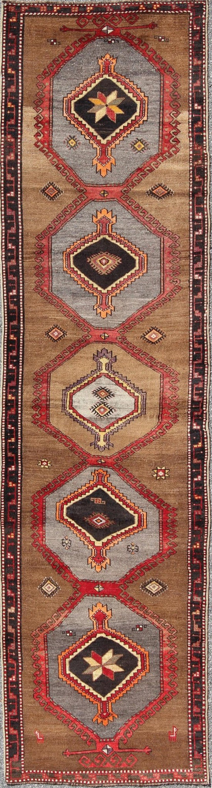 Geometric Turkish Runner with Brown This Turkish runner boasts five geometric medallions along with a unique color scheme. The light and dark shades of brown in the background surround the multi - diamond shaped geometric medallions. The multi - col... - Keivan Woven ArtsTU - UGU - 3337 - 5876Rug