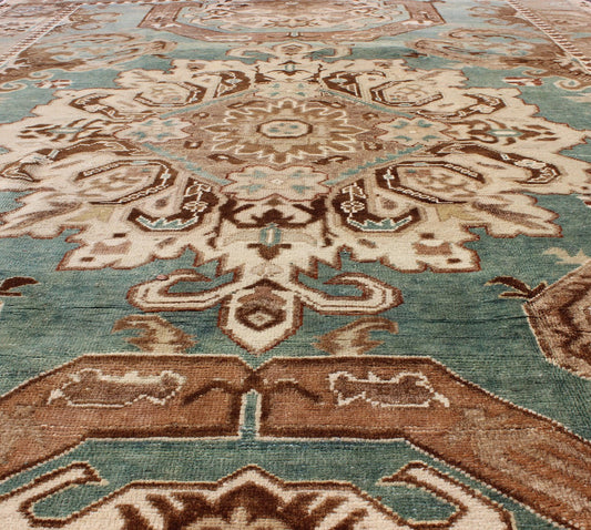 Vintage Hand Knotted Turkish Carpet With Geometric Tribal Medallion Design Geometric design rug in brown, turquoise, taupe, and ivory, Keivan Woven Arts / rug tu - ugu - 3402, country of origin / type: Turkey / Oushak, circa 1940 Set on a uni... - Keivan Woven ArtsTU - UGU - 3402 - 5906Rug