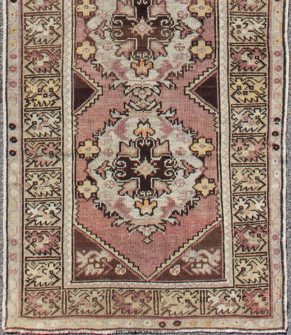 Vintage Turkish Oushak Runner with Floral Medallions in Brown Lavender and Taupe Measures: 2'11'' x 9'8''. This beautiful vintage Oushak runner from 1940s Turkey features a Classic Oushak design. The reddish - colored ground is home to intercon... - Keivan Woven ArtsTU - UGU - 3482 - 6933Rug