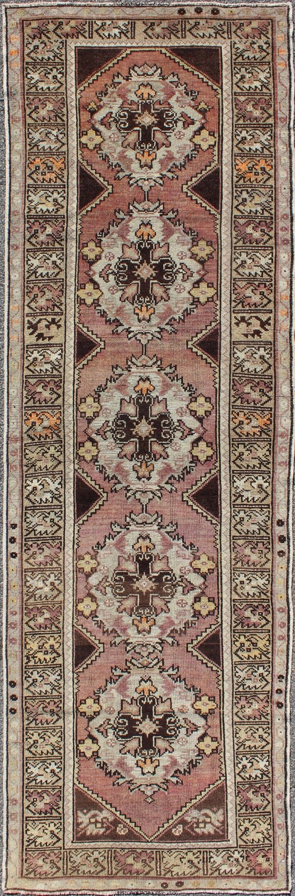 Vintage Turkish Oushak Runner with Floral Medallions in Brown Lavender and Taupe Measures: 2'11'' x 9'8''. This beautiful vintage Oushak runner from 1940s Turkey features a Classic Oushak design. The reddish - colored ground is home to intercon... - Keivan Woven ArtsTU - UGU - 3482 - 6933Rug
