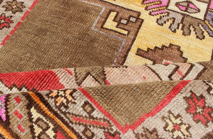 Unique & Colorful Turkish Kars Runner with Tribal Designs and Geometric Motifs Vintage Turkish runner in greenish Brown background, ivory border with accent colors, red, pink, tan, green, bright yellow, taupe, rug/TU - UGU - 4806, country of origin... - Keivan Woven ArtsTU - UGU - 4806 - 10287Rug