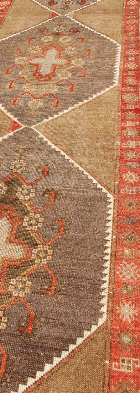 Colorful Vintage Turkish Runner with Diamond Medallions in Lt. Camel, orange and Gray Long and narrow vintage runner from Turkey with multi geometric diamond medallion design in camel background, rust, gray, orange, brown and taupe. rug/TU - UGU... - Keivan Woven ArtsTU - UGU - 4808 - 10297Rug