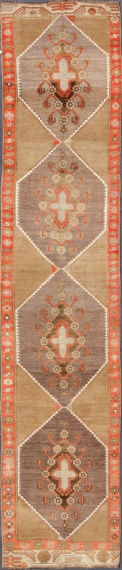 Colorful Vintage Turkish Runner with Diamond Medallions in Lt. Camel, orange and Gray Long and narrow vintage runner from Turkey with multi geometric diamond medallion design in camel background, rust, gray, orange, brown and taupe. rug/TU - UGU... - Keivan Woven ArtsTU - UGU - 4808 - 10297Rug