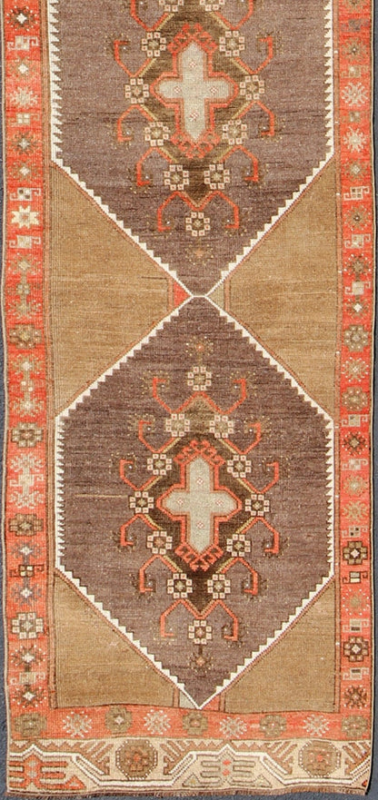 Colorful Vintage Turkish Runner with Diamond Medallions in Lt. Camel, orange and Gray Long and narrow vintage runner from Turkey with multi geometric diamond medallion design in camel background, rust, gray, orange, brown and taupe. rug/TU - UGU... - Keivan Woven ArtsTU - UGU - 4808 - 10297Rug
