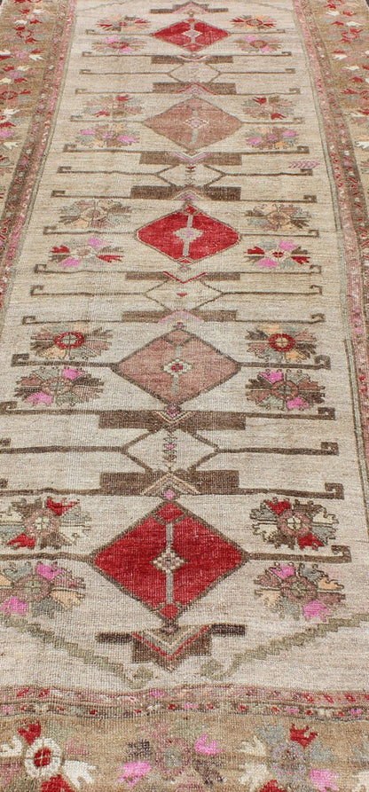 Vintage Unique Oushak Runner with Tribal Designs and Geometric Motifs kwarugs Vintage Turkish runner in red, pink, beige, tan, green, bright lavender, taupe, rug tu - ugu - 4809, country of origin / type: Turkey / Oushak, circa 1950 This... - Keivan Woven ArtsTU - UGU - 4809 - 10301Rug