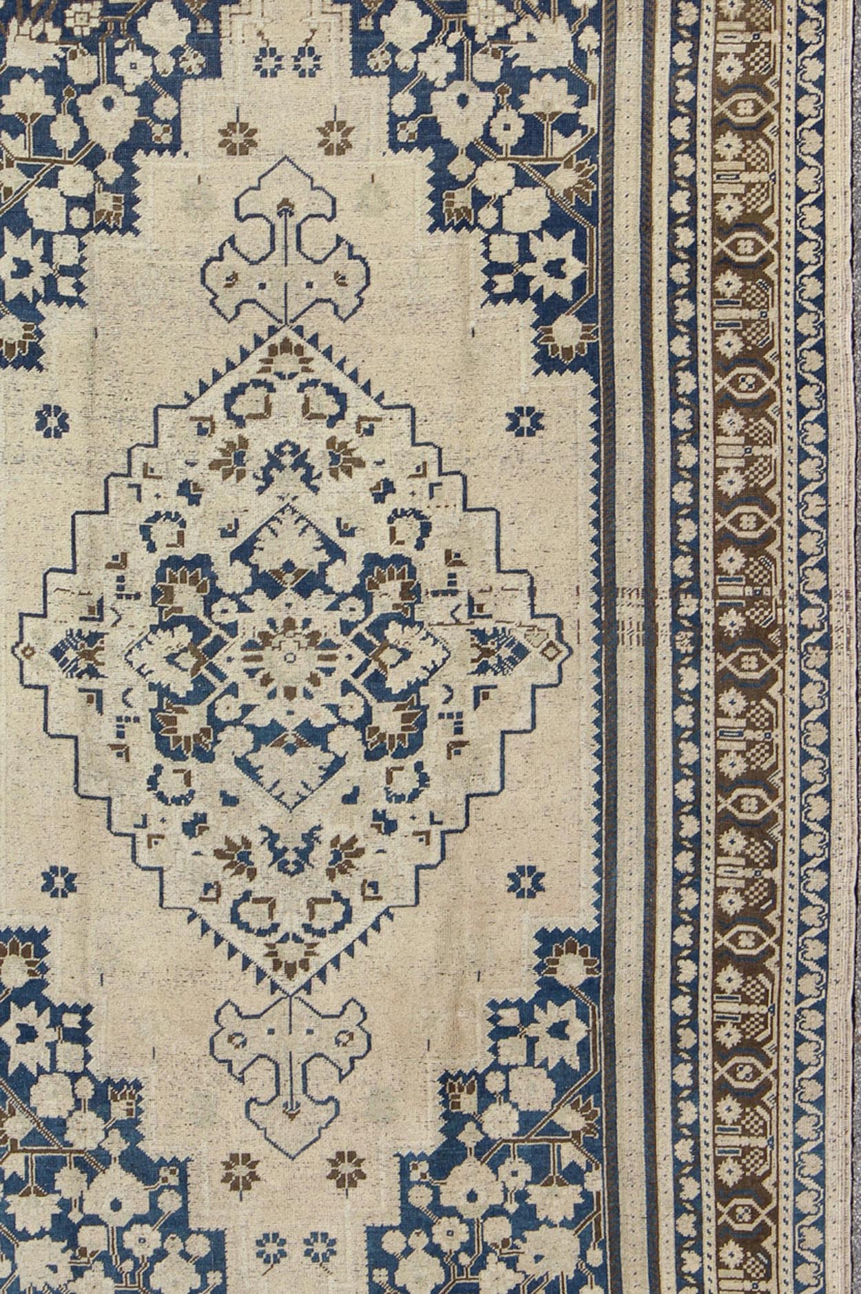 Vintage Turkish Oushak Rug with Medium Blue, Brown and Cream Colors. Vintage Turkish Oushak rug, Rug TU - UGU - 54, country of origin / type: Turkey / Oushak, circa mid - 20th century. This exquisite vintage Turkish Oushak features a star medal... - Keivan Woven ArtsTU - UGU - 54 - 2848Rug