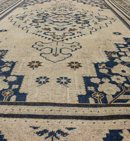 Vintage Turkish Oushak Rug with Medium Blue, Brown and Cream Colors. Vintage Turkish Oushak rug, Rug TU - UGU - 54, country of origin / type: Turkey / Oushak, circa mid - 20th century. This exquisite vintage Turkish Oushak features a star medal... - Keivan Woven ArtsTU - UGU - 54 - 2848Rug