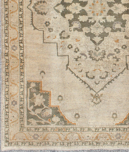 Vintage Turkish Oushak Rug with Floral Medallion Design in Light Tones, in neutrals, light orange and gray green. Keivan Woven Arts/ rug TU - VEY - 136071, country of origin / type: Turkey / Oushak, circa 1940 Measures: 5'5 x 8'6 This strikin... - Keivan Woven ArtsTU - VEY - 136071 - 5116Rug