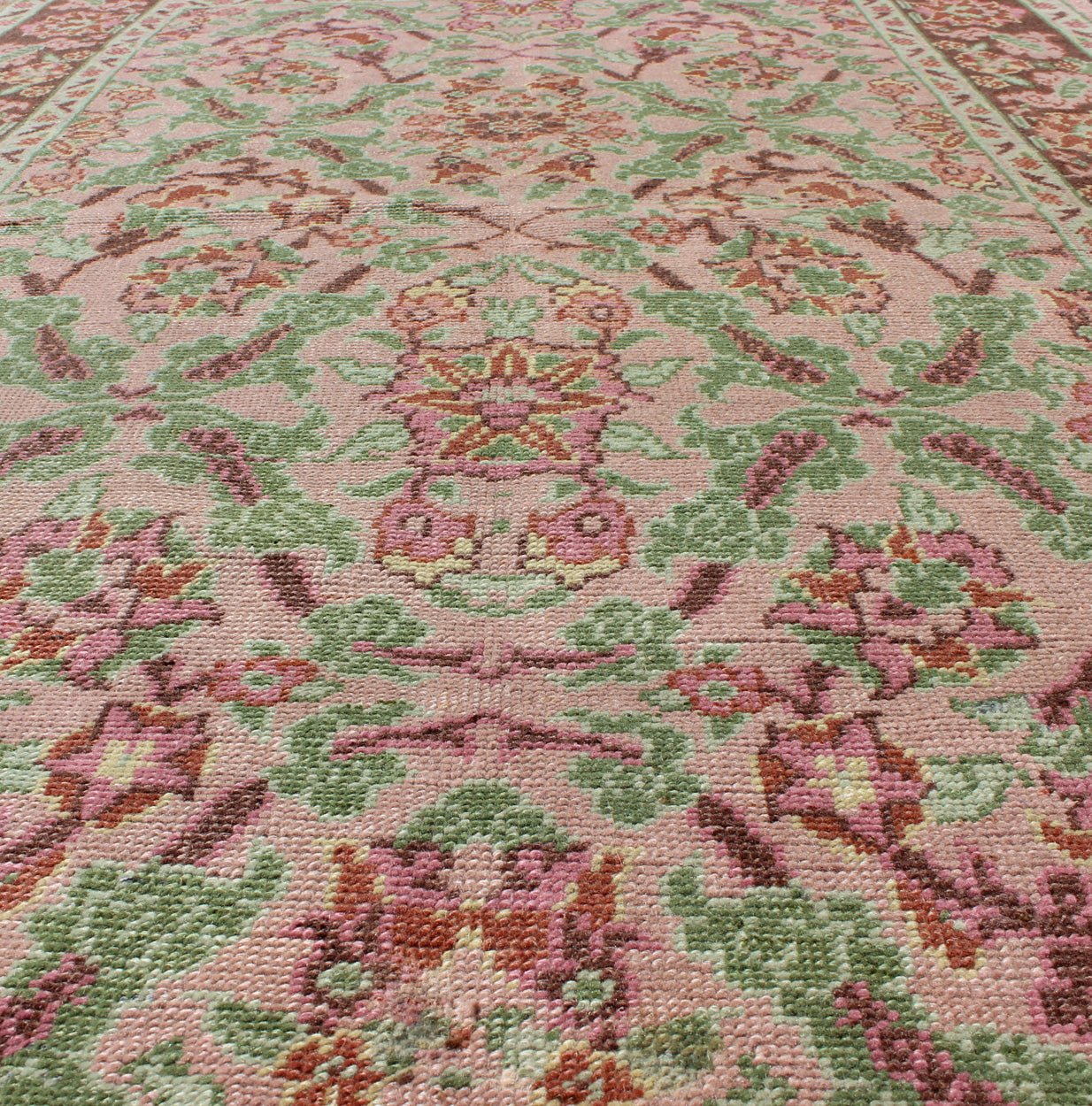 Pink, Rose, and Green Floral Design Midcentury Vintage Turkish Oushak Area Rug Measures: 4'1 x 6'7 Set on a light pink field with an all - over pattern, this beautiful midcentury Turkish Oushak rug (circa 1940) features cross - latch an... - Keivan Woven ArtsTU - VEY - 136611 - 9226
