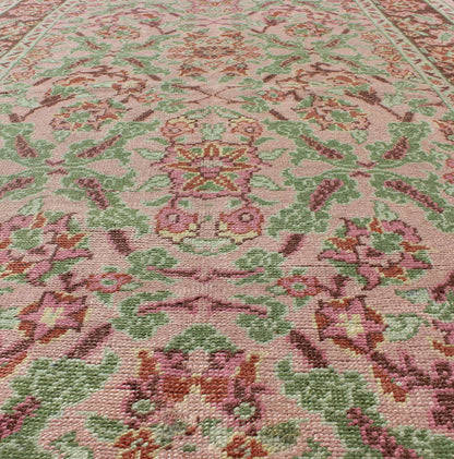 Pink, Rose, and Green Floral Design Midcentury Vintage Turkish Oushak Area Rug Measures: 4'1 x 6'7 Set on a light pink field with an all - over pattern, this beautiful midcentury Turkish Oushak rug (circa 1940) features cross - latch an... - Keivan Woven ArtsTU - VEY - 136611 - 9226