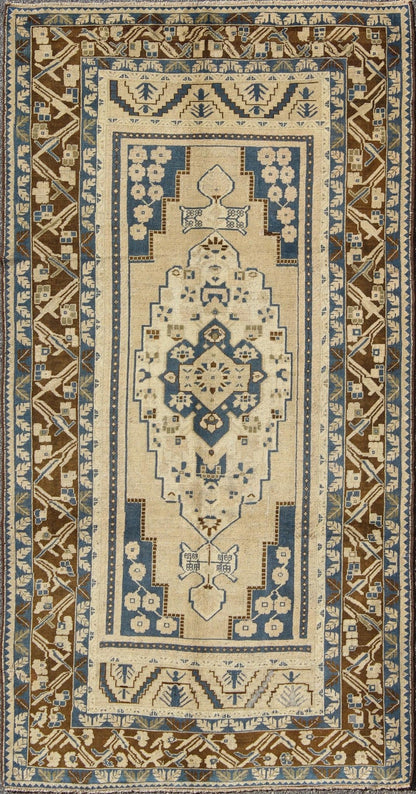 Blue and Brown Oushak Vintage Rug from Turkey with Geometric Layered Medallion, Keivan Woven Arts / rug TU - VEY - 17, country of origin / type: Turkey / Oushak, circa mid - 20th century This vintage Turkish Oushak carpet (circa mid - 20th century) feat... - Keivan Woven ArtsTU - VEY - 17 - 3178Rug