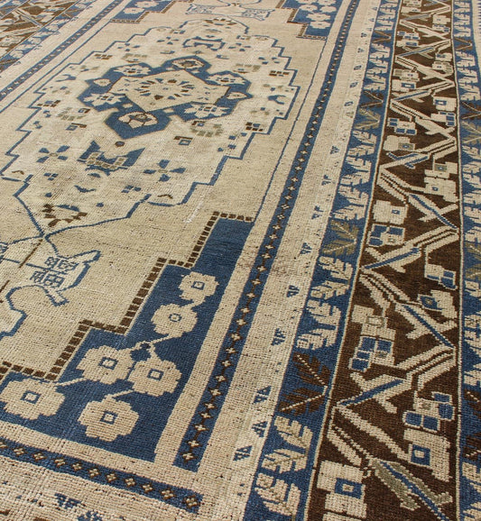 Blue and Brown Oushak Vintage Rug from Turkey with Geometric Layered Medallion, Keivan Woven Arts / rug TU - VEY - 17, country of origin / type: Turkey / Oushak, circa mid - 20th century This vintage Turkish Oushak carpet (circa mid - 20th century) feat... - Keivan Woven ArtsTU - VEY - 17 - 3178