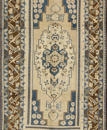 Blue and Brown Oushak Vintage Rug from Turkey with Geometric Layered Medallion, Keivan Woven Arts / rug TU - VEY - 17, country of origin / type: Turkey / Oushak, circa mid - 20th century This vintage Turkish Oushak carpet (circa mid - 20th century) feat... - Keivan Woven ArtsTU - VEY - 17 - 3178Rug
