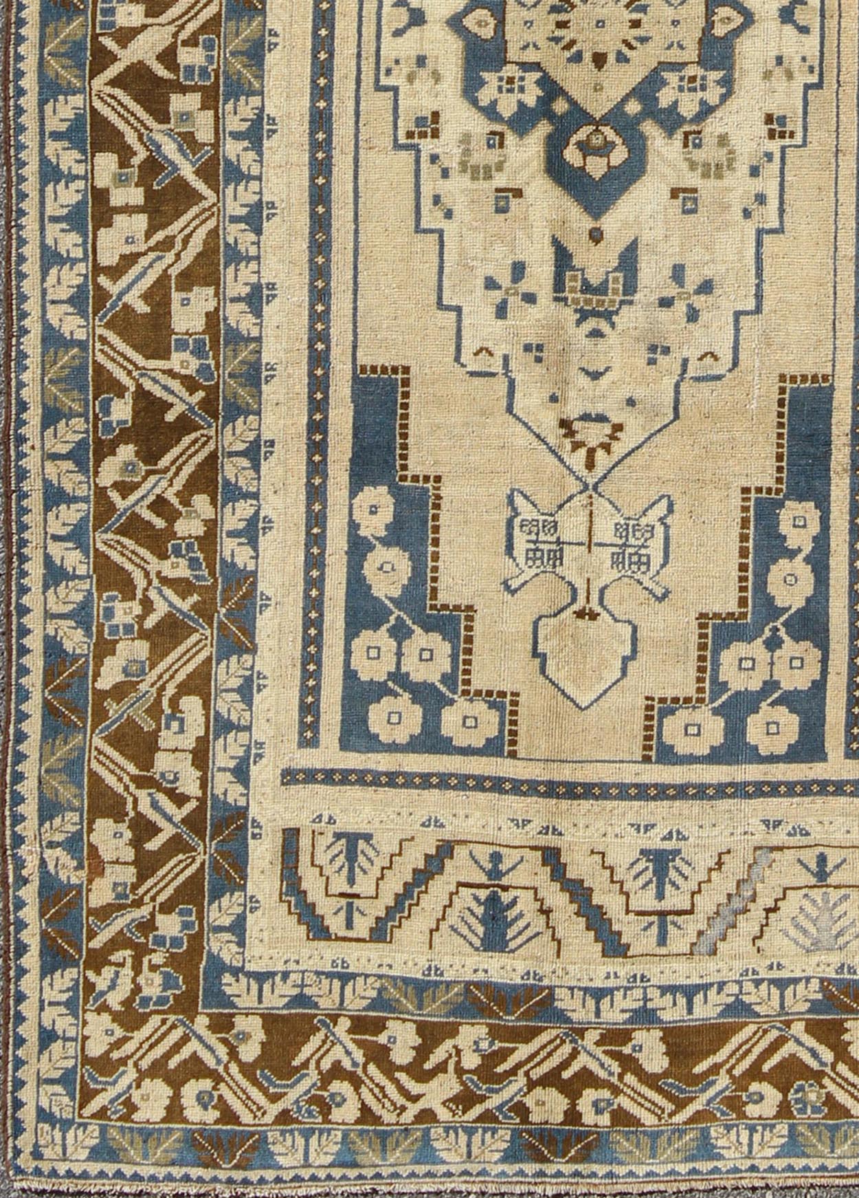 Blue and Brown Oushak Vintage Rug from Turkey with Geometric Layered Medallion, Keivan Woven Arts / rug TU - VEY - 17, country of origin / type: Turkey / Oushak, circa mid - 20th century This vintage Turkish Oushak carpet (circa mid - 20th century) feat... - Keivan Woven ArtsTU - VEY - 17 - 3178Rug