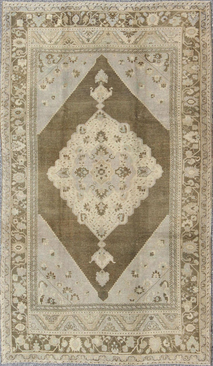 Nude, taupe, and brown medallion design Turkish vintage Oushak rug, rug tu - vey - 3281, country of origin / type: Turkey / Oushak, circa 1940. This striking vintage Turkish Oushak rug bears a brown - colored body that is highlighted by a dazzling med... - Keivan Woven ArtsTU - VEY - 3281 - 6241Rug