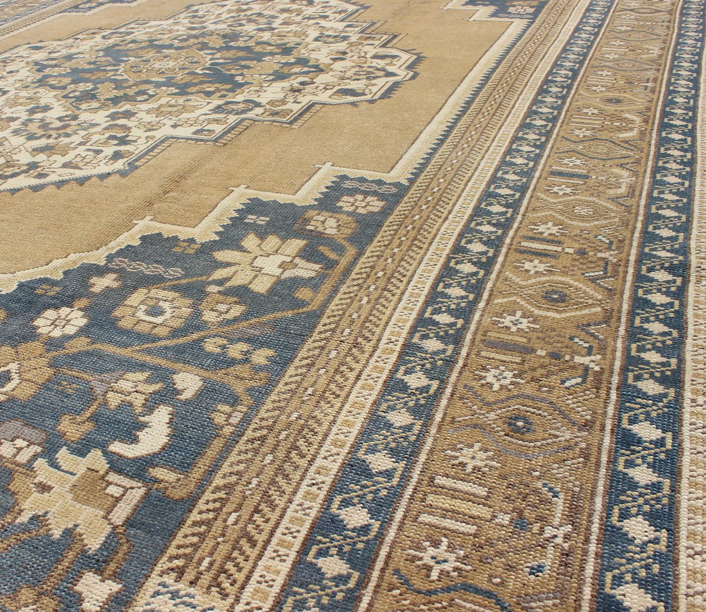 Vintage Turkish Oushak with Floral Medallion in Bronze and Blue Color Measures: 6'10'' x 11'5'' Characterized by a comely and highly representative Oushak composition, this vintage carpet beautifully communicates the finer characteristics of Oush... - Keivan Woven ArtsTU - VEY - 3283 - 6245Rug
