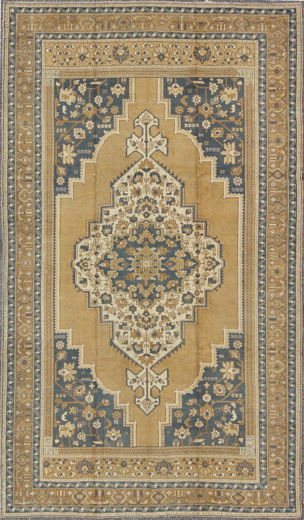 Vintage Turkish Oushak with Floral Medallion in Bronze and Blue Color Measures: 6'10'' x 11'5'' Characterized by a comely and highly representative Oushak composition, this vintage carpet beautifully communicates the finer characteristics of Oush... - Keivan Woven ArtsTU - VEY - 3283 - 6245Rug