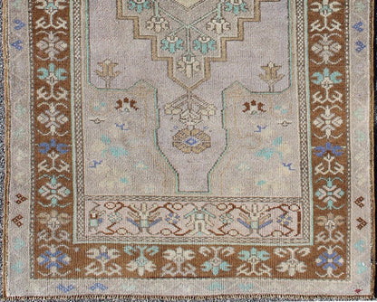 Vintage Oushak Rug in Light Lavender Background and Chocolate Brown Border. Vintage Oushak rug with central medallion in Light lavender, Taupe, Khaki, Teal green, blue accent colors and chocolate brown border. Keivan Woven Arts Rug TU - VEY - 3287,... - Keivan Woven ArtsTU - VEY - 3287 - 5910Rug