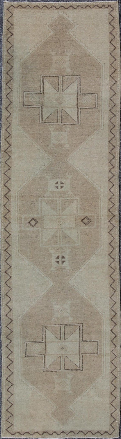 Neutral Oushak Runner This Oushak runner presents three unique medallions laid out across a solid beige field. Each medallion contains a variation of beige, tan, cream, and brown, which blend together to accentuate its delicate geometrical desig... - Keivan Woven ArtsTU - VEY - 3288 - 5916Rug