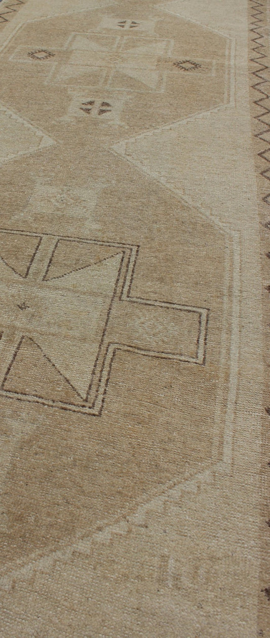 Neutral Oushak Runner This Oushak runner presents three unique medallions laid out across a solid beige field. Each medallion contains a variation of beige, tan, cream, and brown, which blend together to accentuate its delicate geometrical desig... - Keivan Woven ArtsTU - VEY - 3288 - 5916Rug