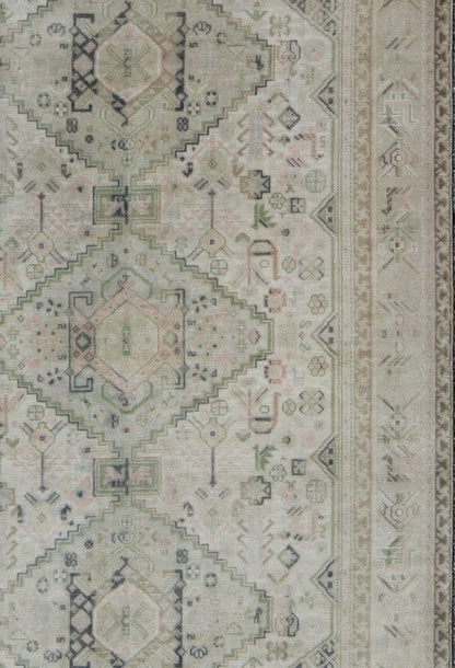 Vintage Turkish Tribal Medallion Oushak in Muted Green, Pink, and Off White Measures: 5'10 x 9'11. This vintage Turkish Oushak rug features a unique blend of colors and an intricately beautiful design. The medallions, arranged in a v... - Keivan Woven ArtsTU - VEY - 4602 - 7911Rug