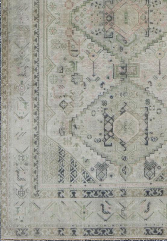 Vintage Turkish Tribal Medallion Oushak in Muted Green, Pink, and Off White Measures: 5'10 x 9'11. This vintage Turkish Oushak rug features a unique blend of colors and an intricately beautiful design. The medallions, arranged in a v... - Keivan Woven ArtsTU - VEY - 4602 - 7911Rug