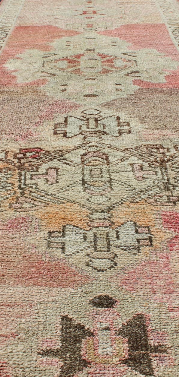 Vintage Turkish Oushak Runner with Medallion Design in Pink, Light Green & Taupe. Multi - Toned Medallion Oushak Carpet, rug tu - vey - 4811, country of origin / type: Turkey / Oushak, circa 1940. This Oushak Narrow runner from mid - 20th century Turkey ... - Keivan Woven ArtsTU - VEY - 4811 - 10812Rug