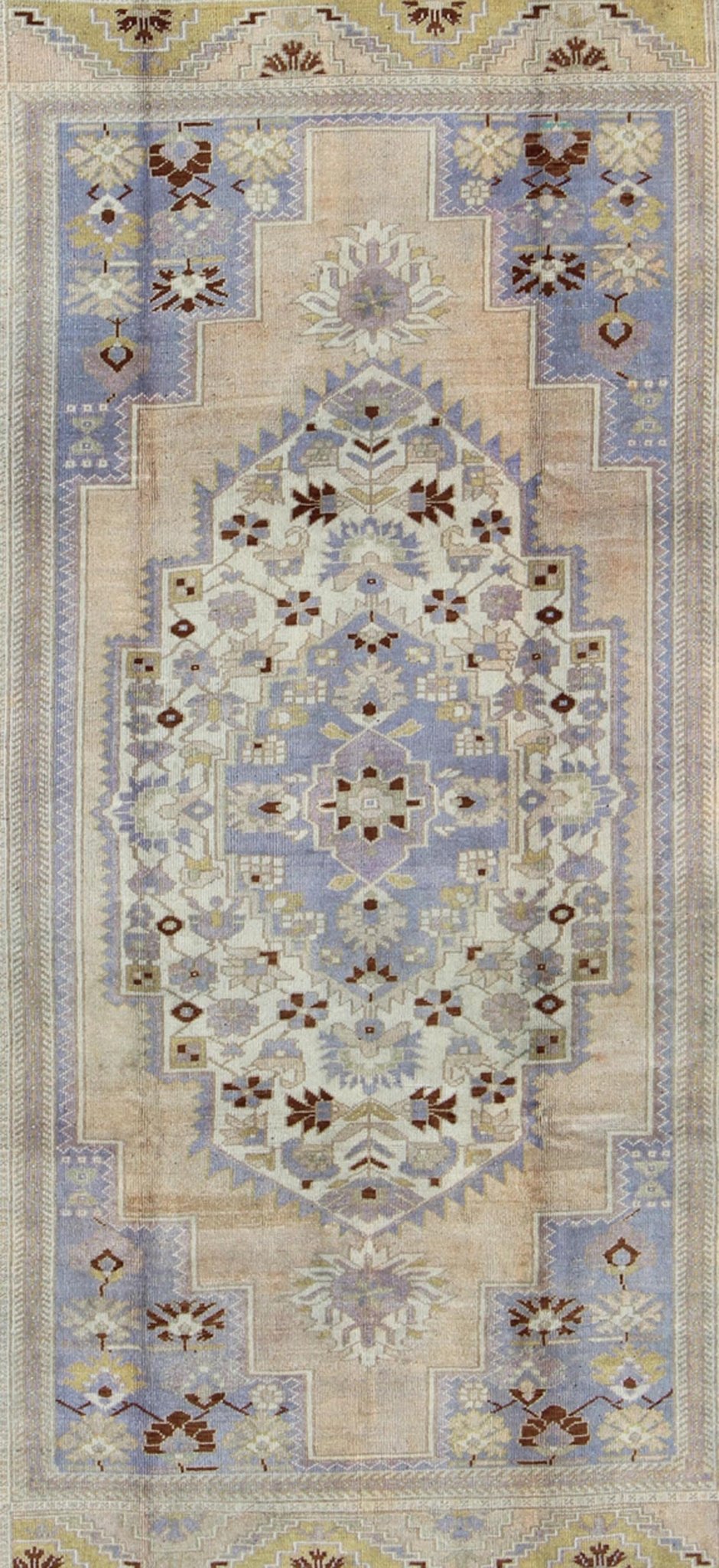 Vintage Turkish Oushak - This stunning vintage Turkish Oushak rug shows a charming combination of warm and cool colors. Set on a brown border with a pop of the same brown throughout, this unique Oushak displays light purple, cream, beige, soft yellow, gr... - Keivan Woven ArtsTU - YUN - 136075 - 4702Rug