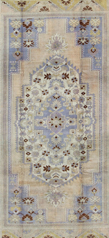Vintage Turkish Oushak - This stunning vintage Turkish Oushak rug shows a charming combination of warm and cool colors. Set on a brown border with a pop of the same brown throughout, this unique Oushak displays light purple, cream, beige, soft yellow, gr... - Keivan Woven ArtsTU - YUN - 136075 - 4702Rug