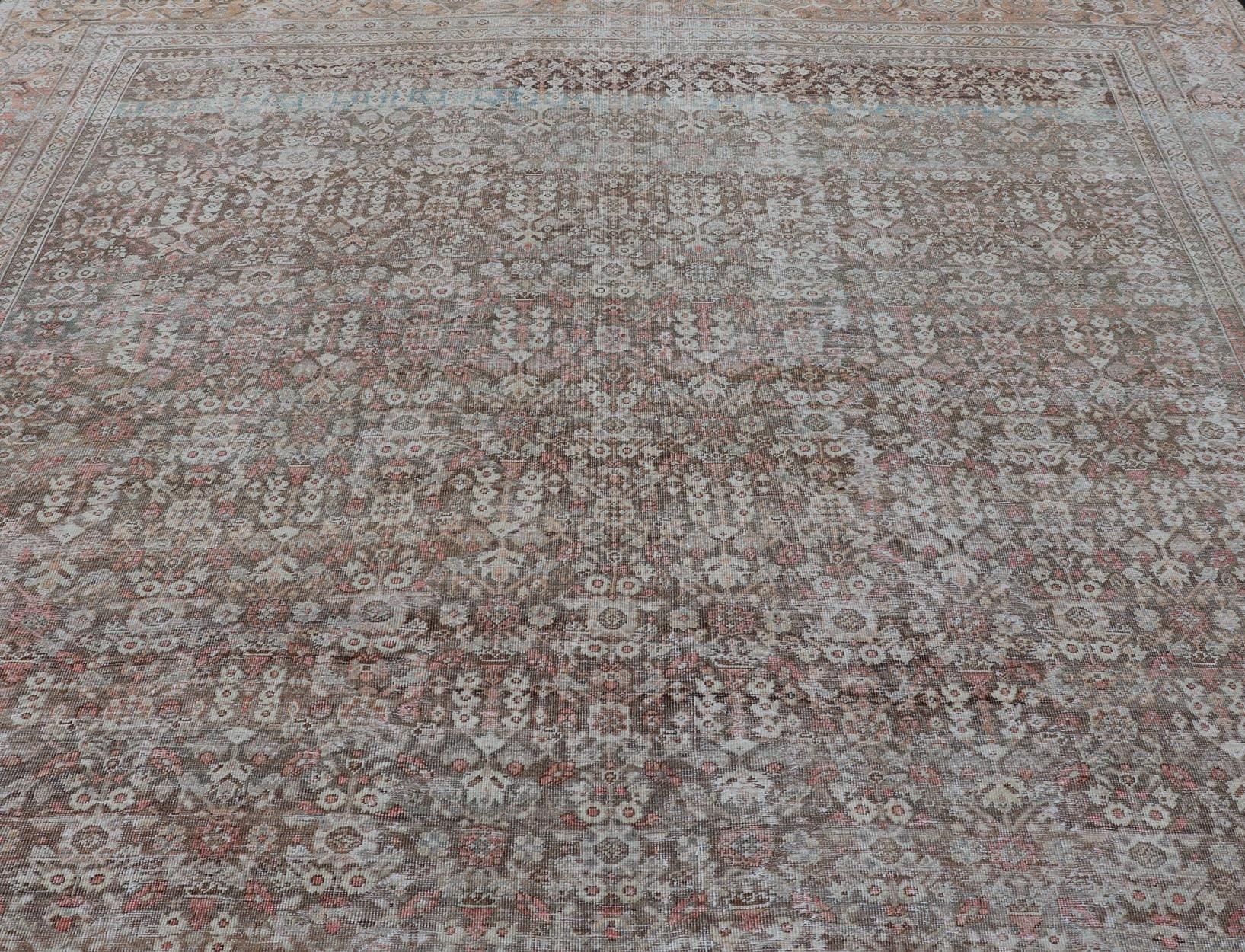 Antique Persian Distressed Sultanabad with All - Over Herati Design in Earthy Tones. rug V21 - 0105; country of origin / type: Persian / Sultanabad, circa 1920. Antique distressed Sultanabad. Measures: 11'10 x 16'6 This impressive antique distr... - Keivan Woven ArtsV21 - 0105 - 14530Rug