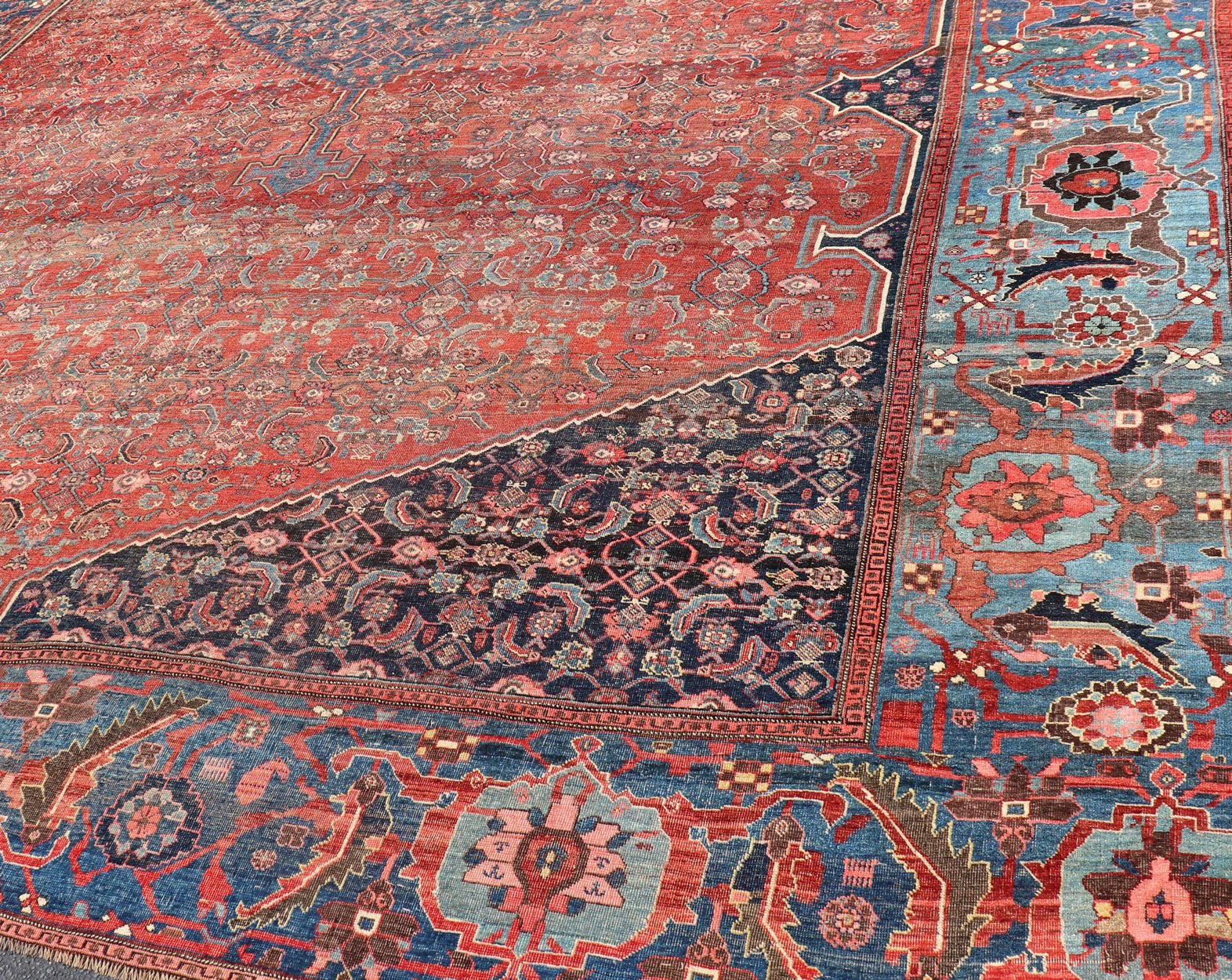 Very Large Antique Persian Bidjar Rug in Multi Shades of Blue, Tera - cotta & Red. Classic Bidjar in Tera - cotta and variety of beautiful red tones, framed by variegated shades of blue colors in the border with large Scale Geometrics. Bidjar antique r... - Keivan Woven ArtsV21 - 0106 - 14536