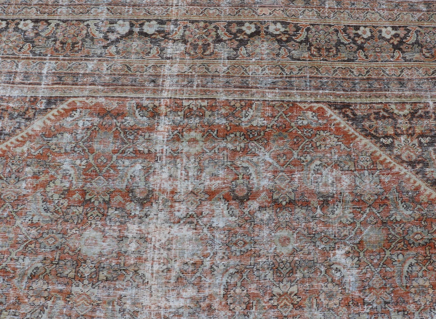 Distressed Antique Persian Mahal Rug in Wool with Floral Design On A Red Field. Keivan Woven Arts; rug V21 - 0107, country of origin / type: Iran / Mahal, circa 1920. Measures: 10'5 x 16'10 This antique Persian Mahal rug an all - over sub - geometric ... - Keivan Woven ArtsV21 - 0107 - 14886Rug