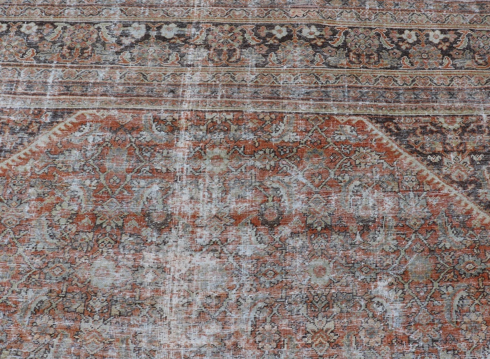 Distressed Antique Persian Mahal Rug in Wool with Floral Design On A Red Field. Keivan Woven Arts; rug V21 - 0107, country of origin / type: Iran / Mahal, circa 1920. Measures: 10'5 x 16'10 This antique Persian Mahal rug an all - over sub - geometric ... - Keivan Woven ArtsV21 - 0107 - 14886