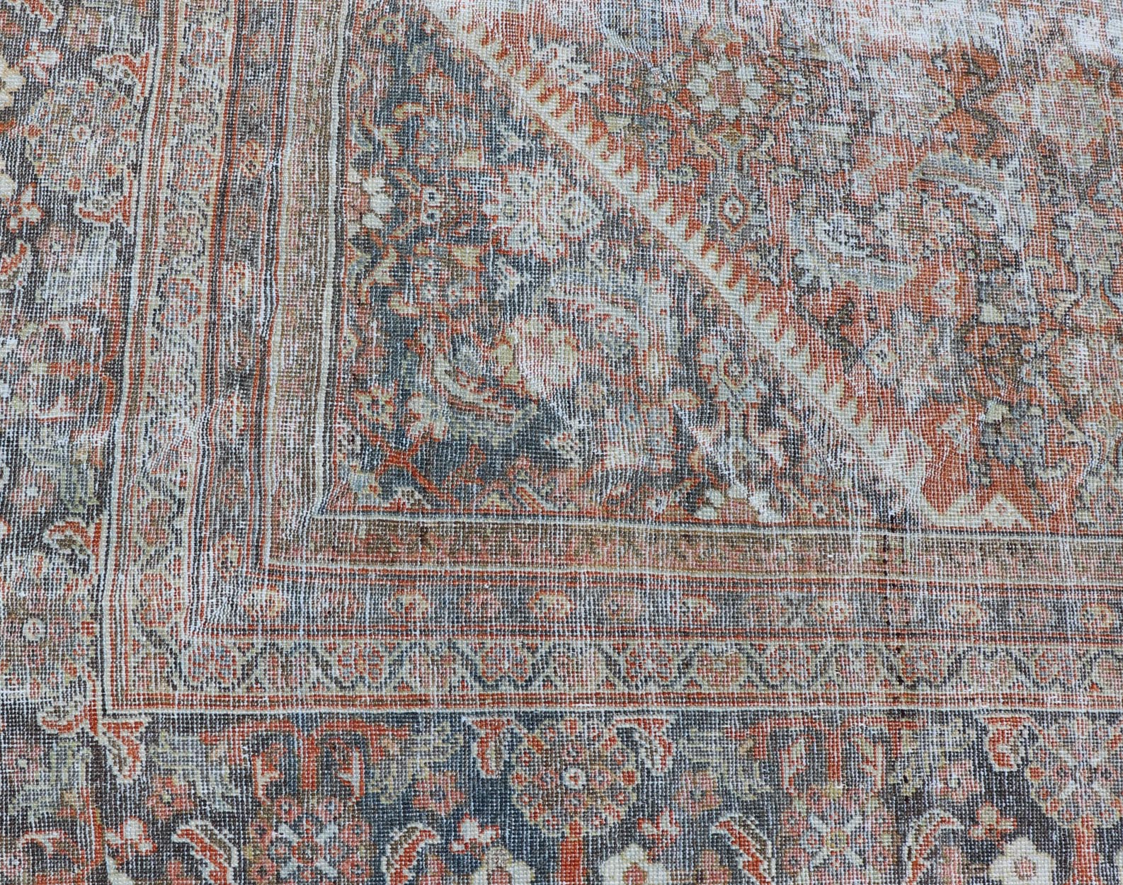 Distressed Antique Persian Mahal Rug in Wool with Floral Design On A Red Field. Keivan Woven Arts; rug V21 - 0107, country of origin / type: Iran / Mahal, circa 1920. Measures: 10'5 x 16'10 This antique Persian Mahal rug an all - over sub - geometric ... - Keivan Woven ArtsV21 - 0107 - 14886