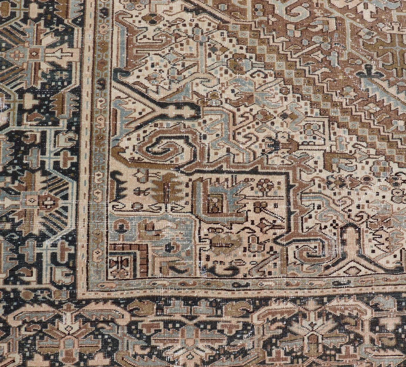 Persian Antique Heriz Rug with Geometric Design in Blue's, Tan, Cream, and Brown. Keivan Woven Arts / rug V21 - 0120, country of origin / type: Iran / Heriz, circa 1930 Measures: 11'5 x 14'7 This magnificent Persian Heriz carpet bears an ex... - Keivan Woven ArtsV21 - 0120 - 14844