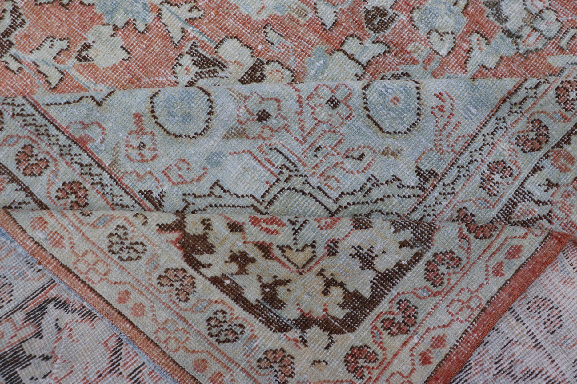 Distressed Antique Medallion Persian Mahal Rug In Faded Orange, Cream, And Brown. Keivan Woven Arts / rug V21 - 0301, country of origin / type: Iran / Mahal, circa 1920s Measures: 10'9 x 13'10 This beautiful antique Persian Mahal rug features an c... - Keivan Woven ArtsV21 - 0301 - 15224