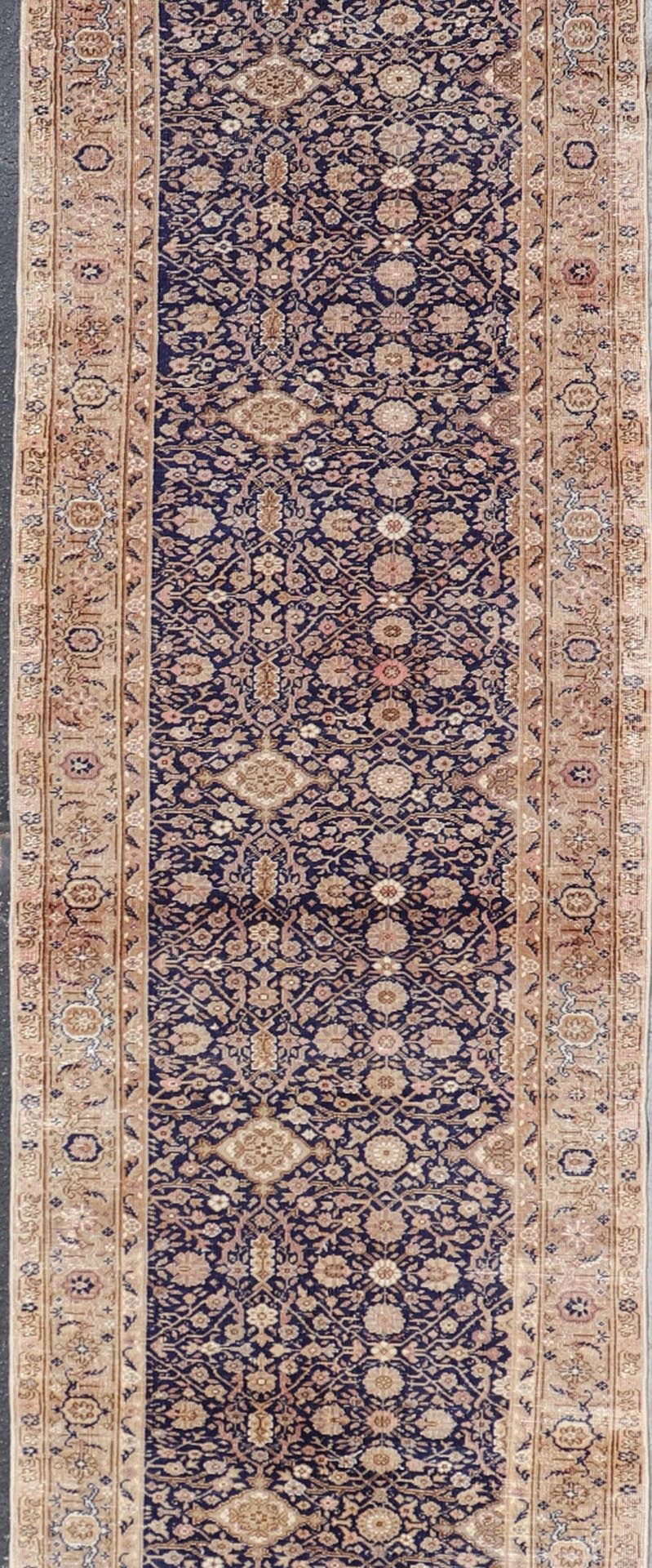 Long Antique Fine Persian Runner with Blue Background and Earthy Tones. Keivan Woven Arts / rug V21 - 0306 - 97, country of origin / type: Turkey / Sivas, circa 1920 Measures: 2'9 x 15'9 Stylized all - over motifs are featured in a pattern on this ... - Keivan Woven ArtsV21 - 0306 - 97 - 15254Rug