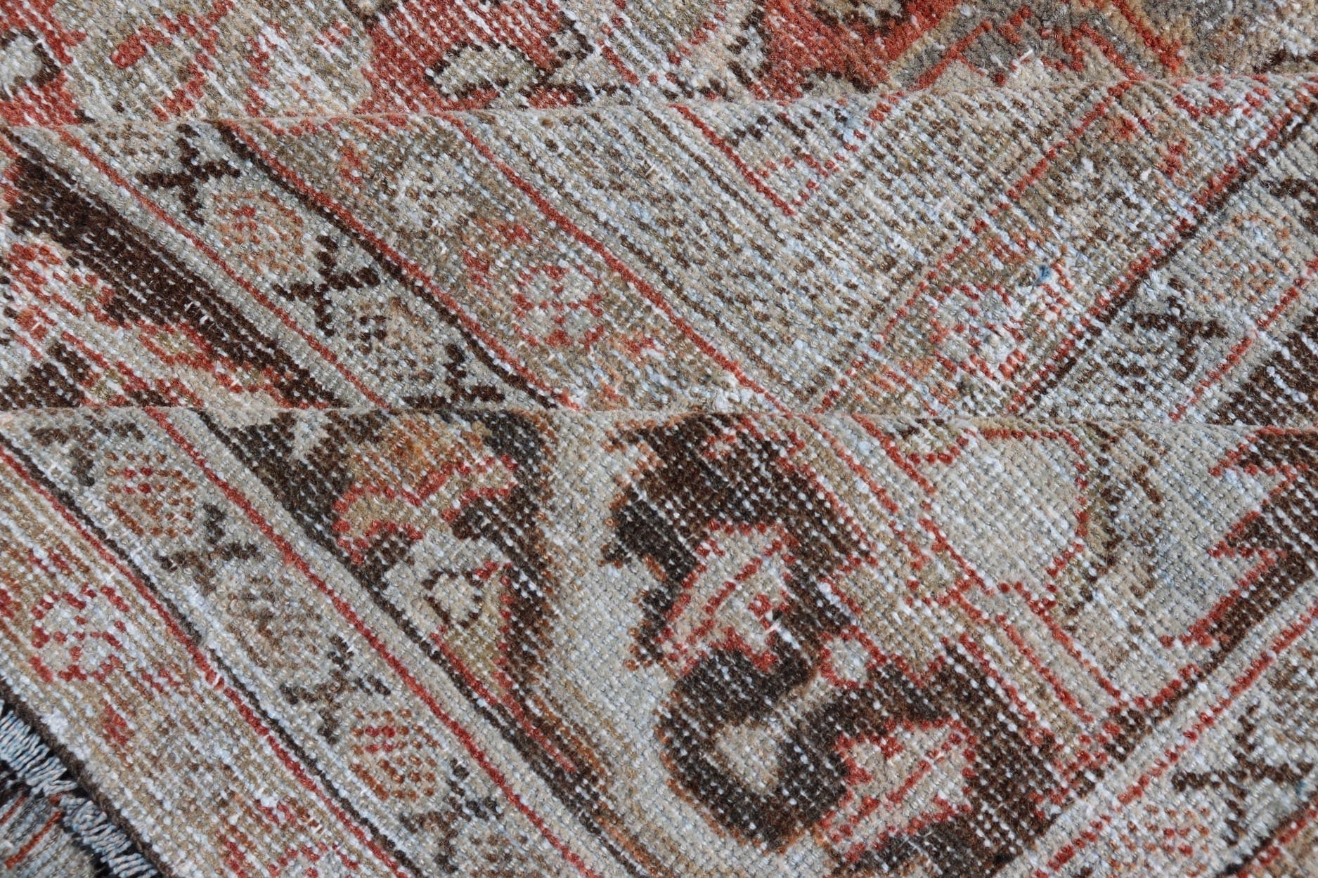 Distressed Antique Hand - Knotted Sultanabad Rug in Wool with Floral Design This antique Persian Sultanabad rug an all - over sub - geometric floral design rendered in orange and earthy tones, set upon an orange background. A complementary, multi - tie... - Keivan Woven ArtsV21 - 0501 - 15719
