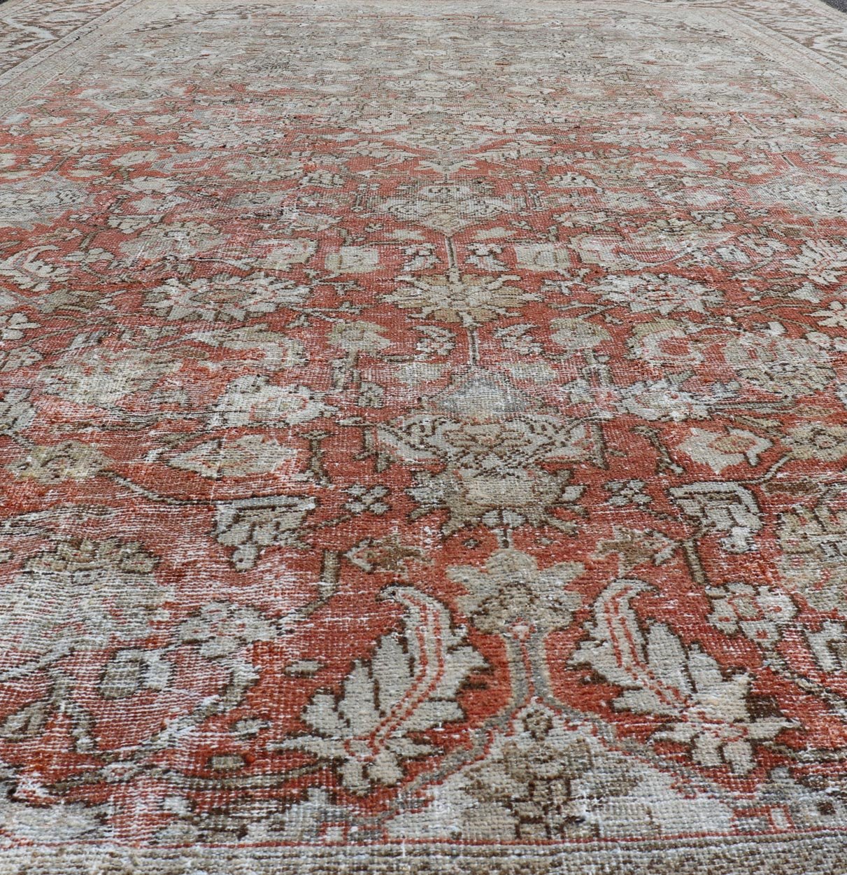 Distressed Antique Hand - Knotted Sultanabad Rug in Wool with Floral Design This antique Persian Sultanabad rug an all - over sub - geometric floral design rendered in orange and earthy tones, set upon an orange background. A complementary, multi - tie... - Keivan Woven ArtsV21 - 0501 - 15719