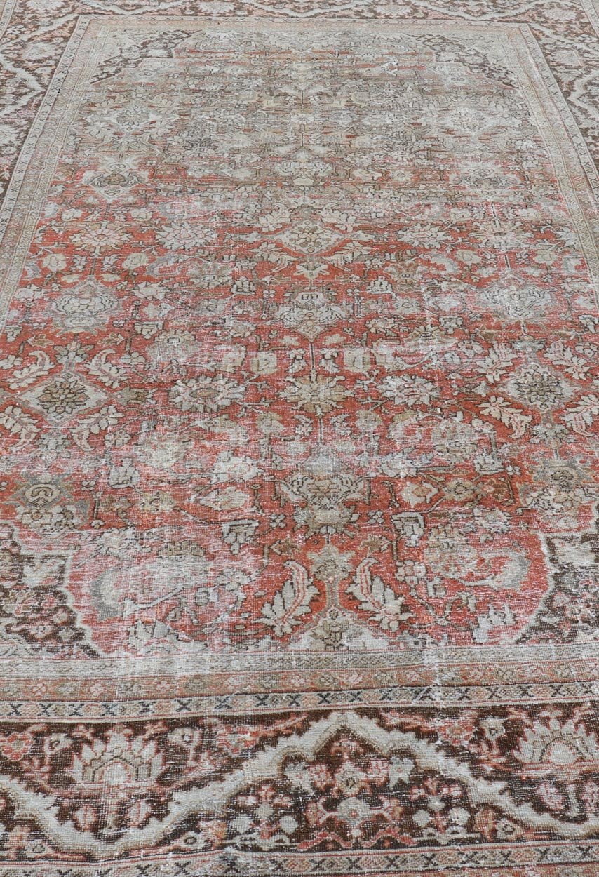 Distressed Antique Hand - Knotted Sultanabad Rug in Wool with Floral Design This antique Persian Sultanabad rug an all - over sub - geometric floral design rendered in orange and earthy tones, set upon an orange background. A complementary, multi - tie... - Keivan Woven ArtsV21 - 0501 - 15719