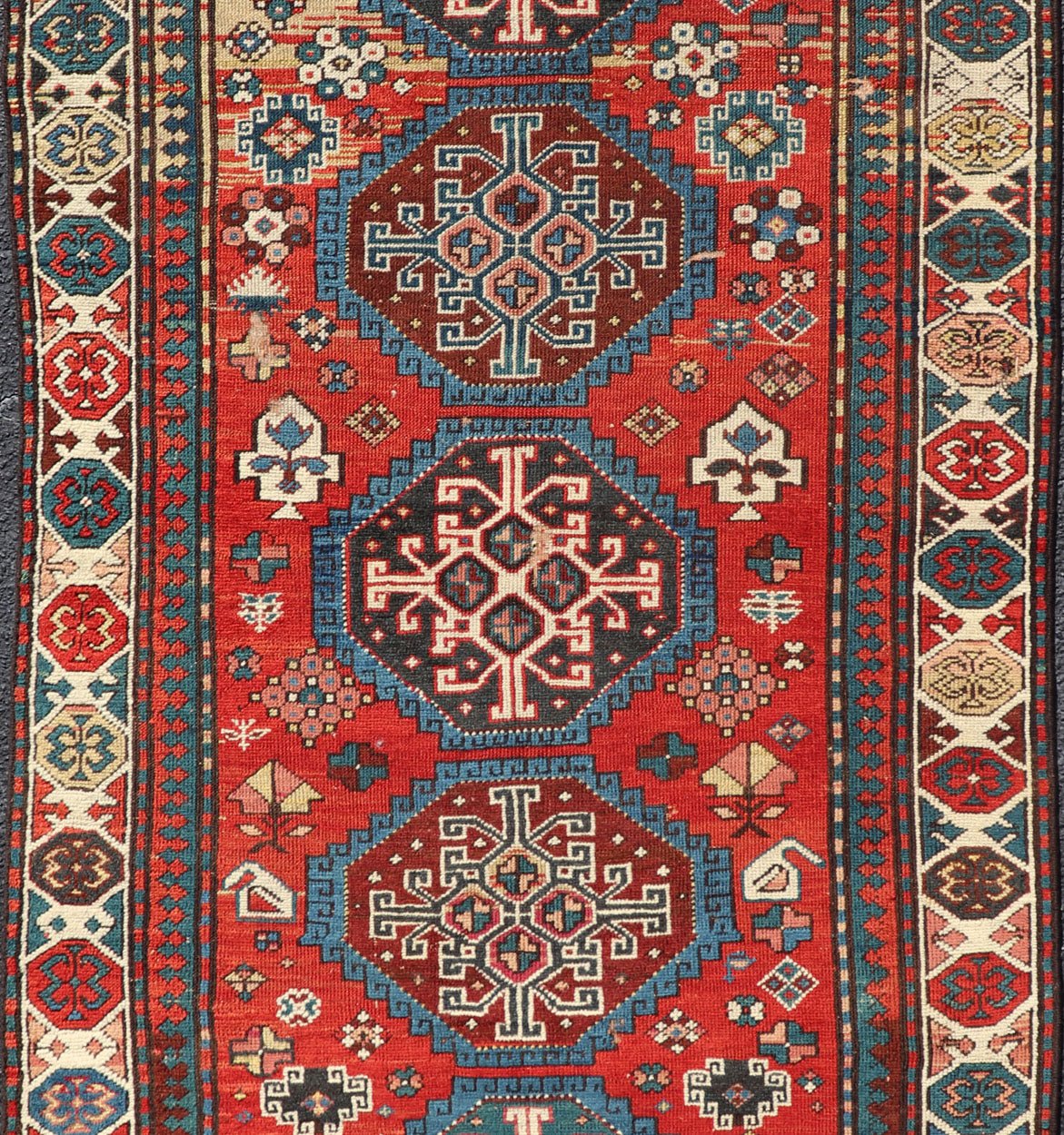 Antique Hand Knotted Caucasian Kazak Rug in Brilliant Red with Geometric Design Tribal geometric medallion design Kazak antique rug, antique Caucasian from Caucasus Region with a beautiful red background in multi - colors, Keivan Woven Arts rug V2... - Keivan Woven ArtsV21 - 0502 - 16394