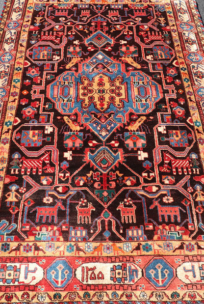 Antique Persian Nahavand Rug with All - Over Sub - Geometric Tribal Design Measures: 4'3 x 9'4. This absolutely stunning Antique Nahavand (circa 1920s) features a symmetrical sub - geometric design rendered in shades of reds, blues, greens, cre... - Keivan Woven ArtsV21 - 1103 - 18341