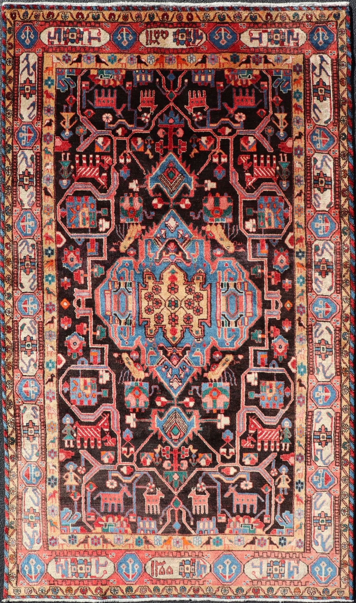 Antique Persian Nahavand Rug with All - Over Sub - Geometric Tribal Design Measures: 4'3 x 9'4. This absolutely stunning Antique Nahavand (circa 1920s) features a symmetrical sub - geometric design rendered in shades of reds, blues, greens, cre... - Keivan Woven ArtsV21 - 1103 - 18341Rug