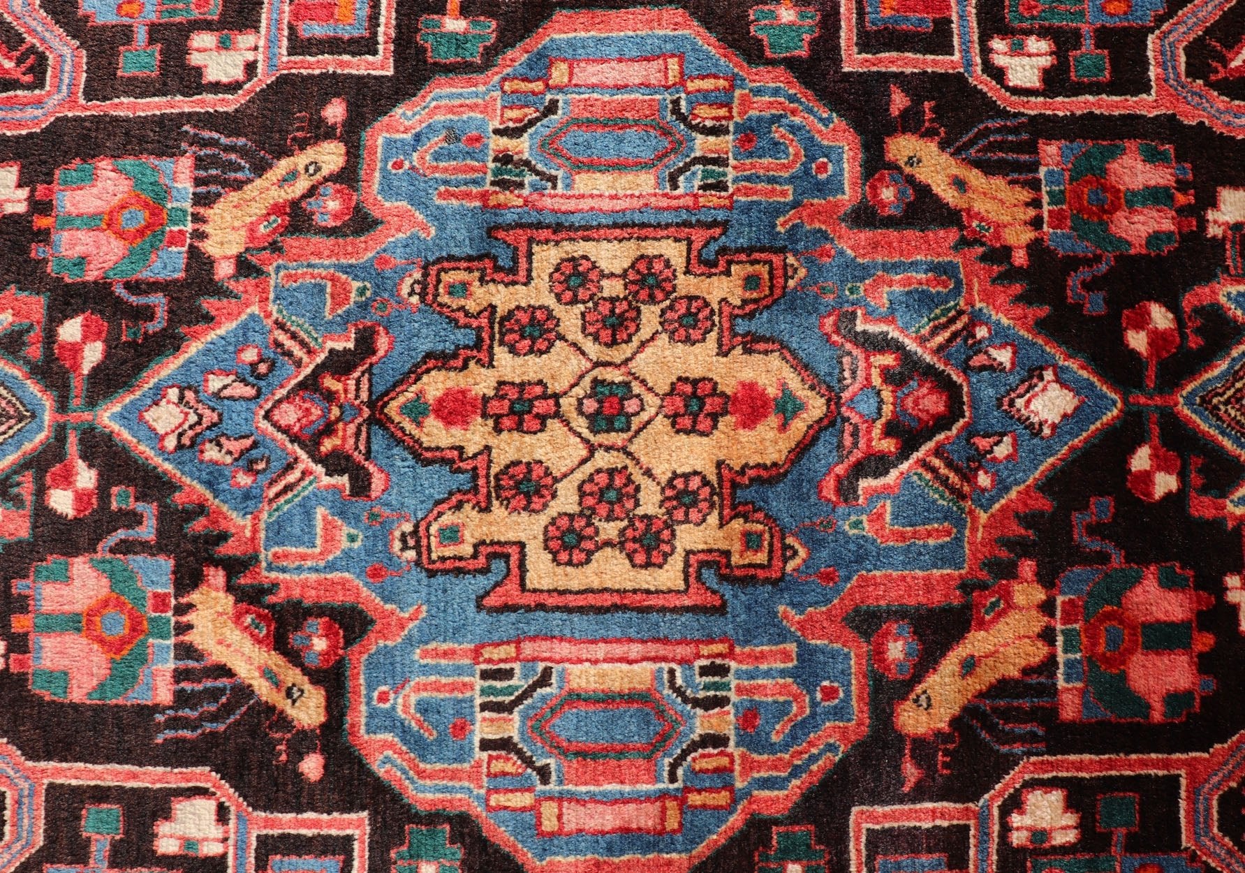 Antique Persian Nahavand Rug with All - Over Sub - Geometric Tribal Design Measures: 4'3 x 9'4. This absolutely stunning Antique Nahavand (circa 1920s) features a symmetrical sub - geometric design rendered in shades of reds, blues, greens, cre... - Keivan Woven ArtsV21 - 1103 - 18341